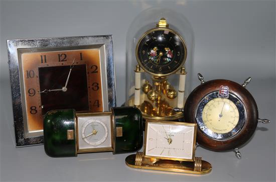 Four various clocks and a barometer
